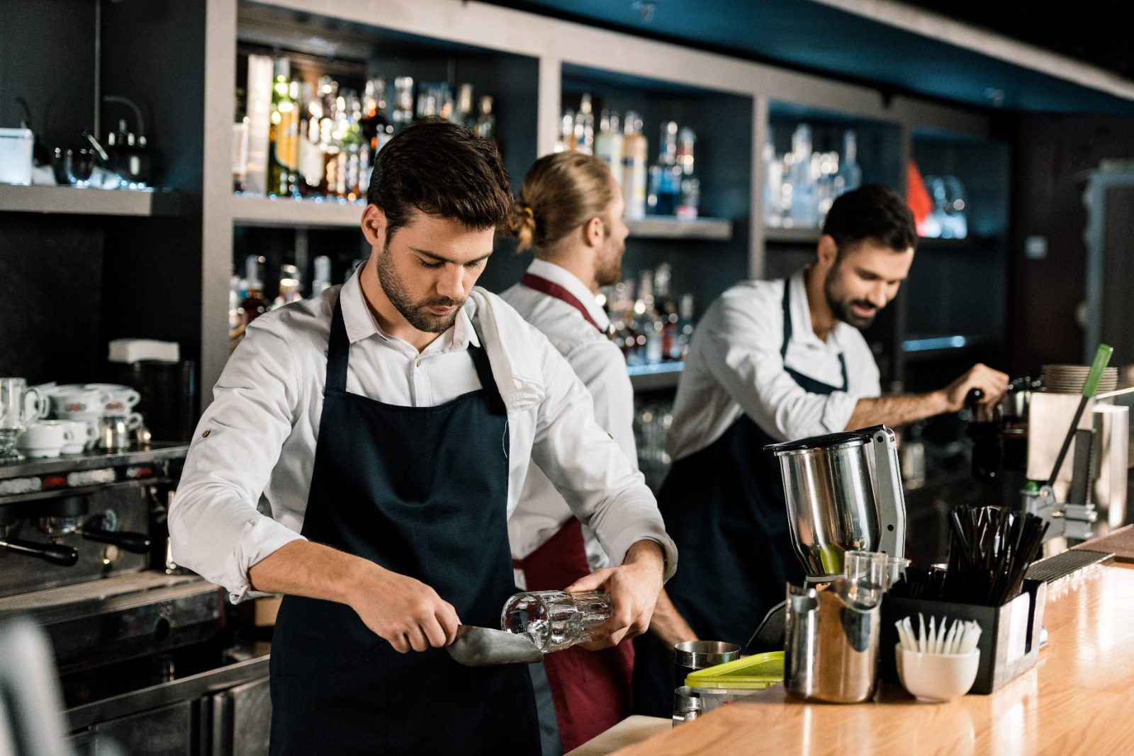 Bartender preparing a drink during a busy shift